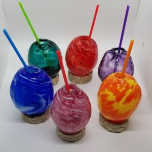 Colorful glass cocktail coconuts! The absolute best in barware for tropical-themed and tiki events.